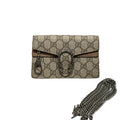 Gucci monogram canvas shoulder bag with a silver-tone horsebit clasp, displayed on a white dust bag with its black and white Gucci box behind it.